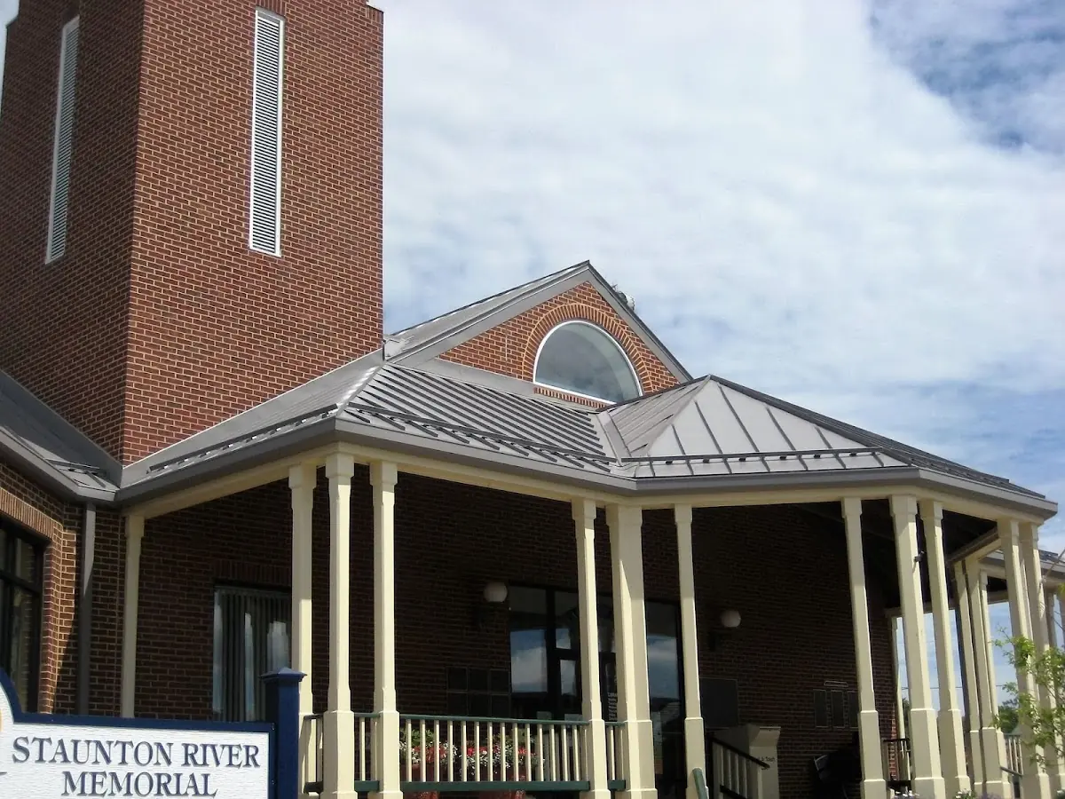 Skilled roofing craftsmen working on a residential roof in Barren River